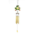 Frog wind chime swaying in gentle breeze outdoors