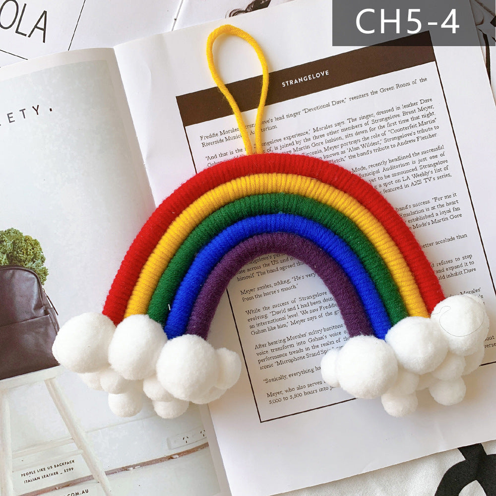 Creative kids room decor with clouds and rainbows