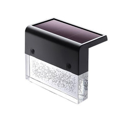 Acrylic solar light shining in a garden setting