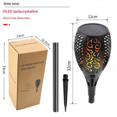 Night view of solar torch illuminating yard