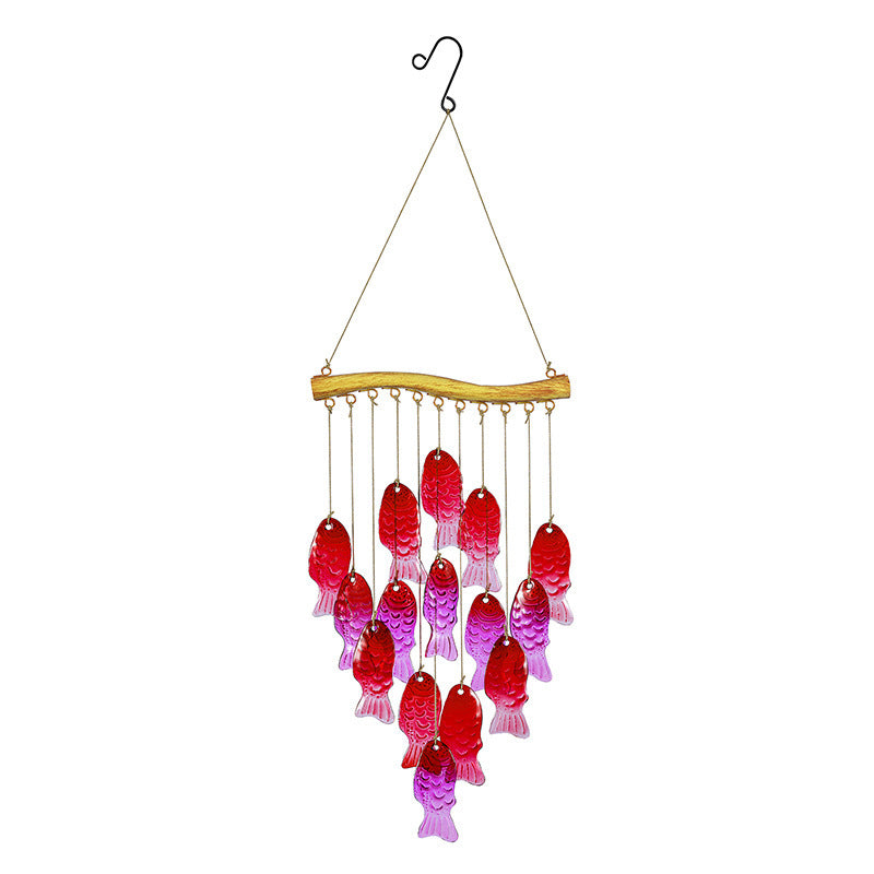 Wind chime displayed near a porch or tree