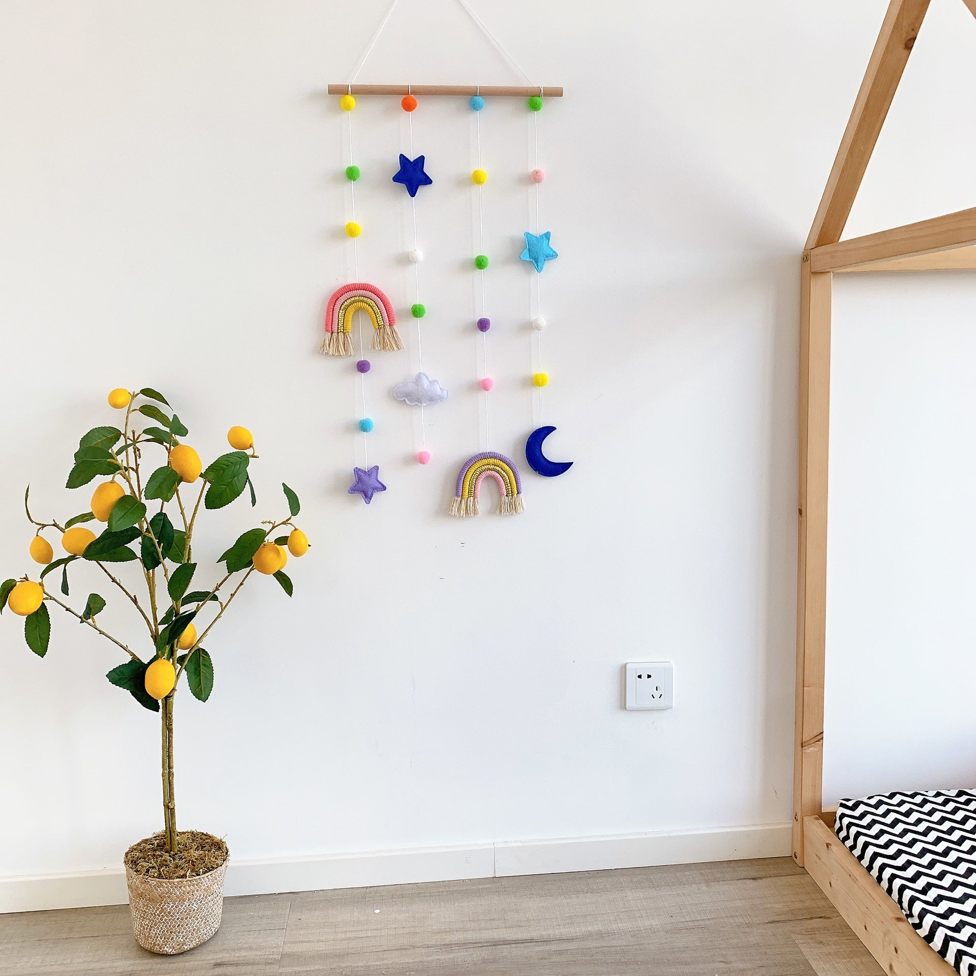 Kids' hair clips displayed on the wall in a colourful organiser