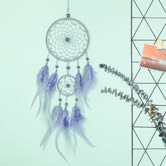 Enchanting dream catcher featuring beads and feathers