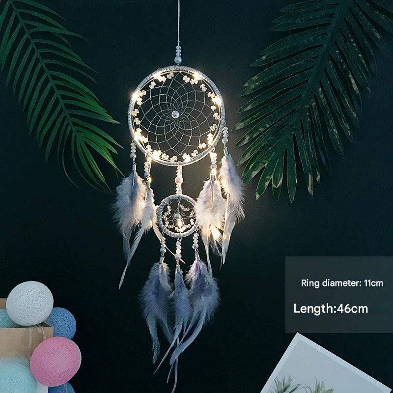 Handmade dream catcher wall hanging with colourful feathers