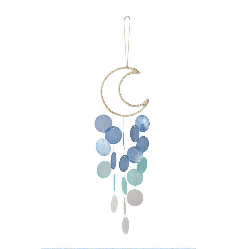 Wind chime catching breeze on balcony image 5