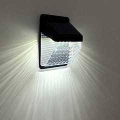 Solar powered wall light installed in garden