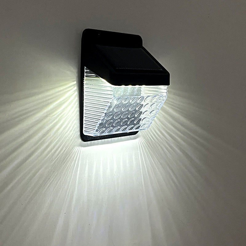 Solar powered wall light installed in garden