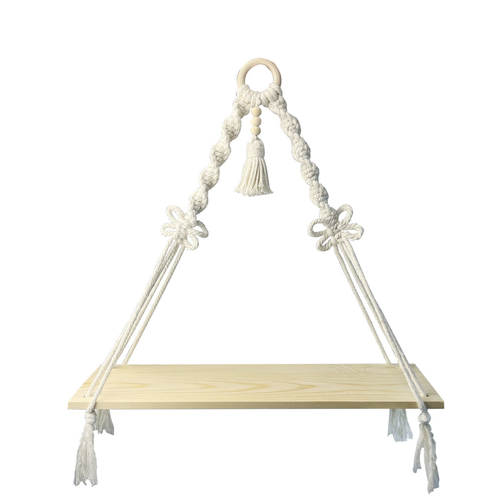 Decorative macrame shelf holding plants indoors