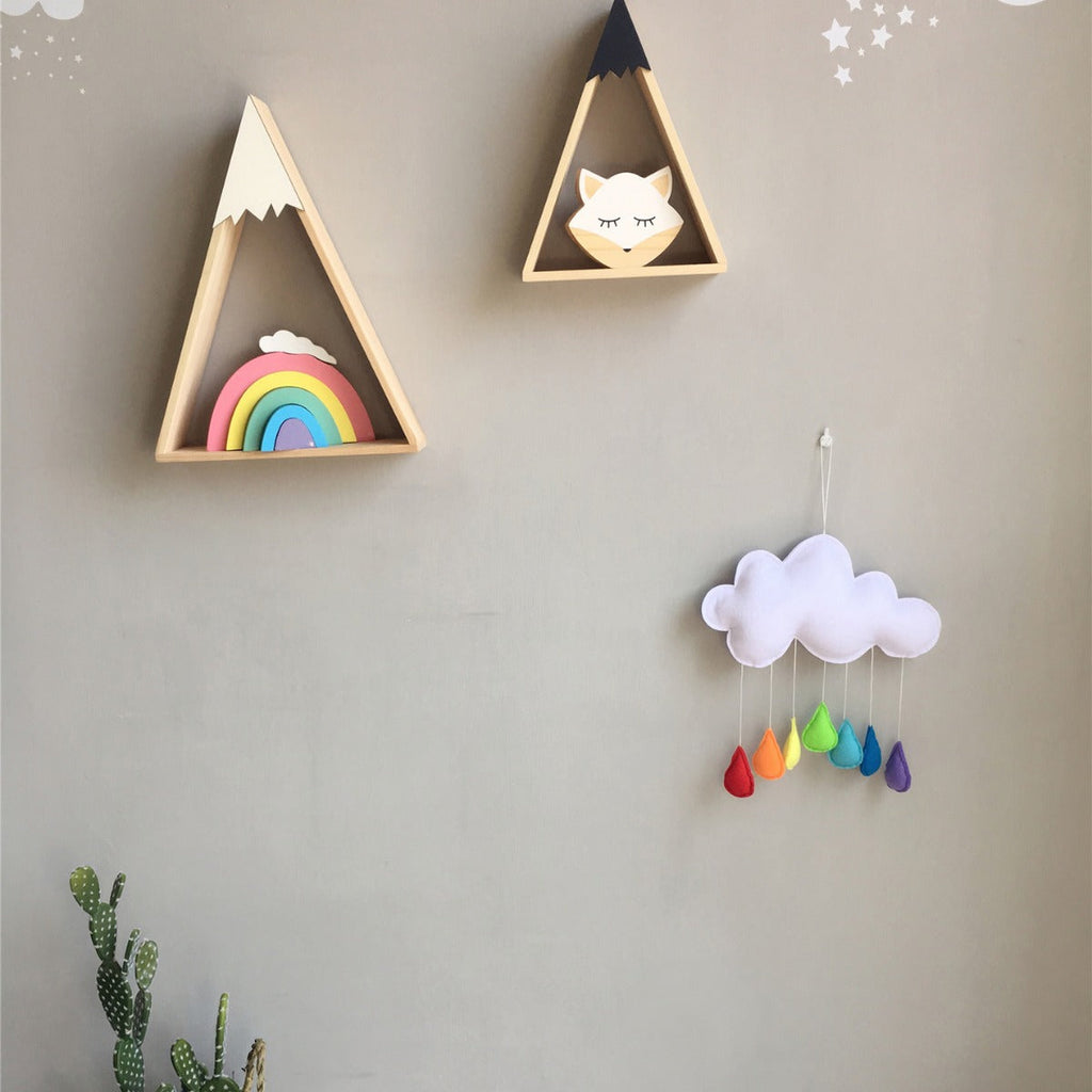colourful felt decorations hanging in a child's room
