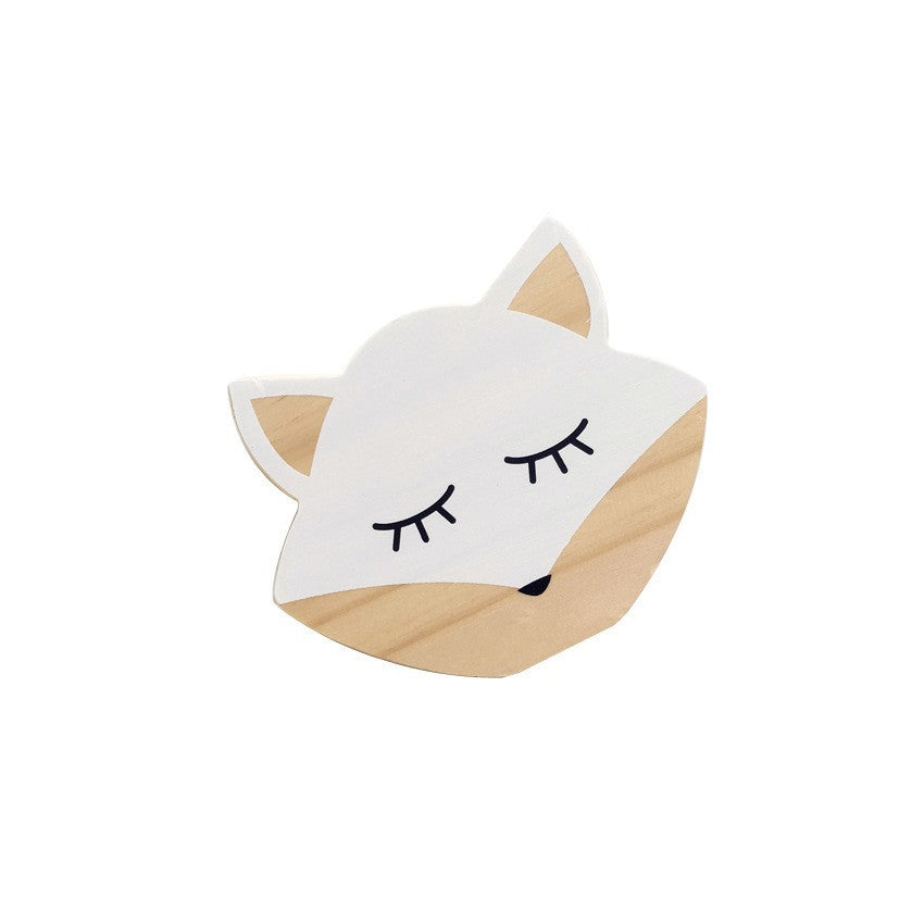 Wooden animal figurines in nursery setting