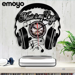 Close-up of vinyl wall clock showcasing music design