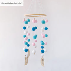 Pom pom wind chime displayed in nursery