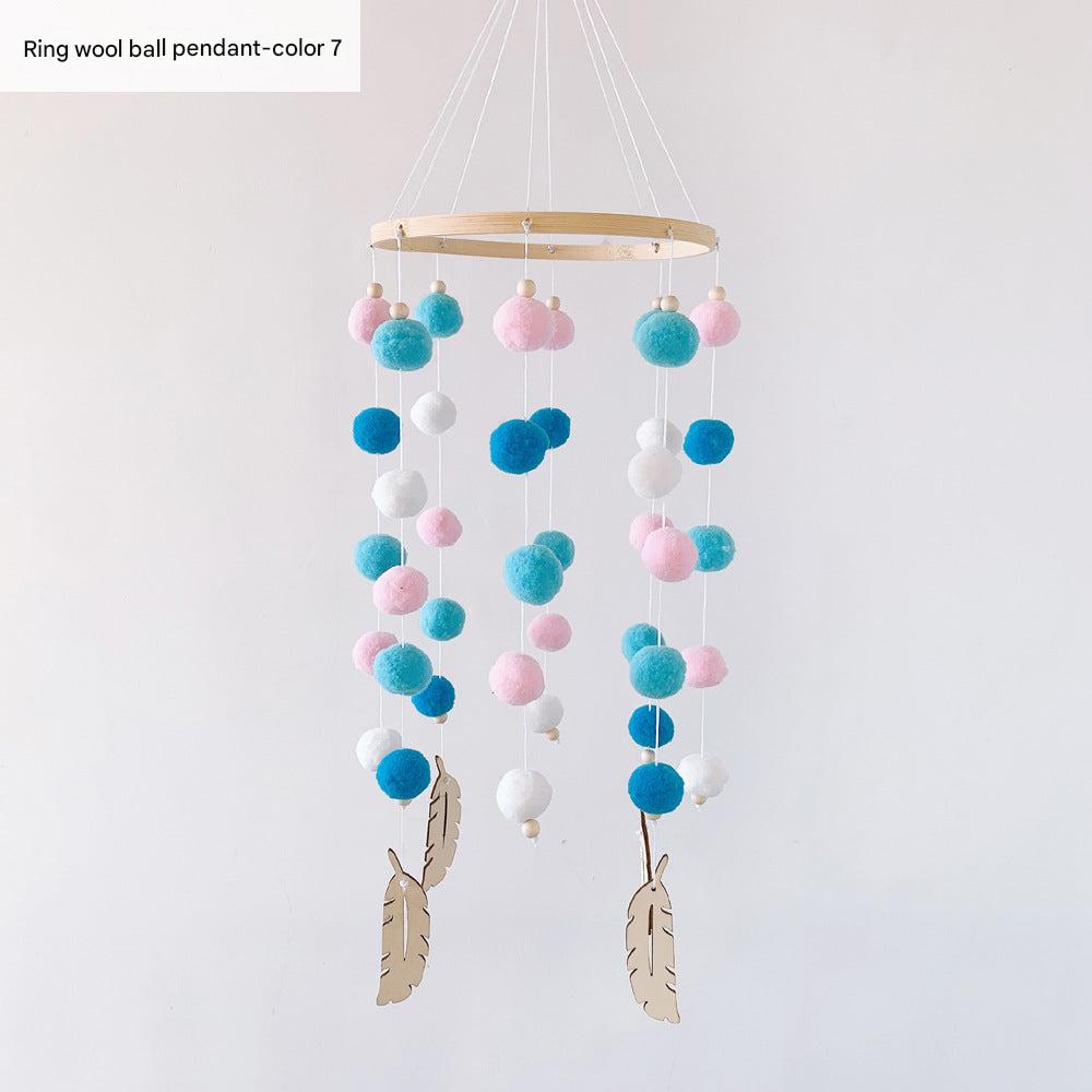 Pom pom wind chime displayed in nursery
