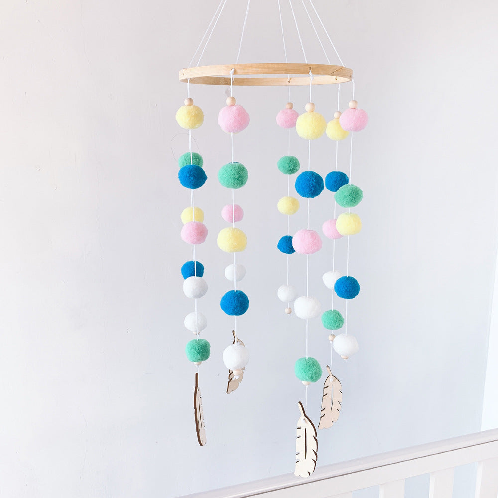 Pom pom wind chime displayed in nursery