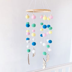 Pom pom wind chime displayed in nursery