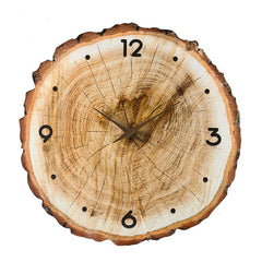 Functional wooden wall clock on wall