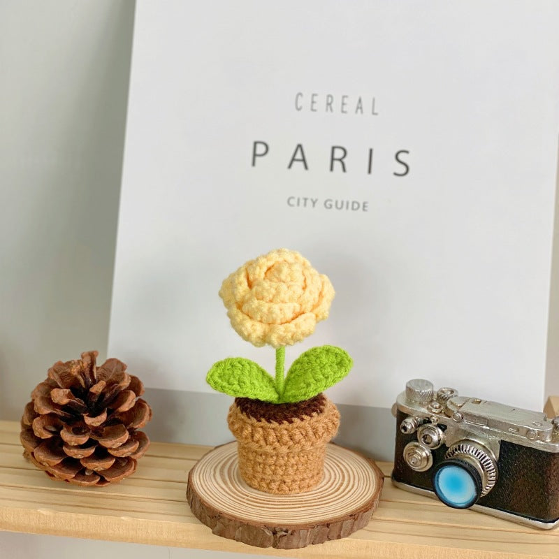 Artificial succulent arrangement on table