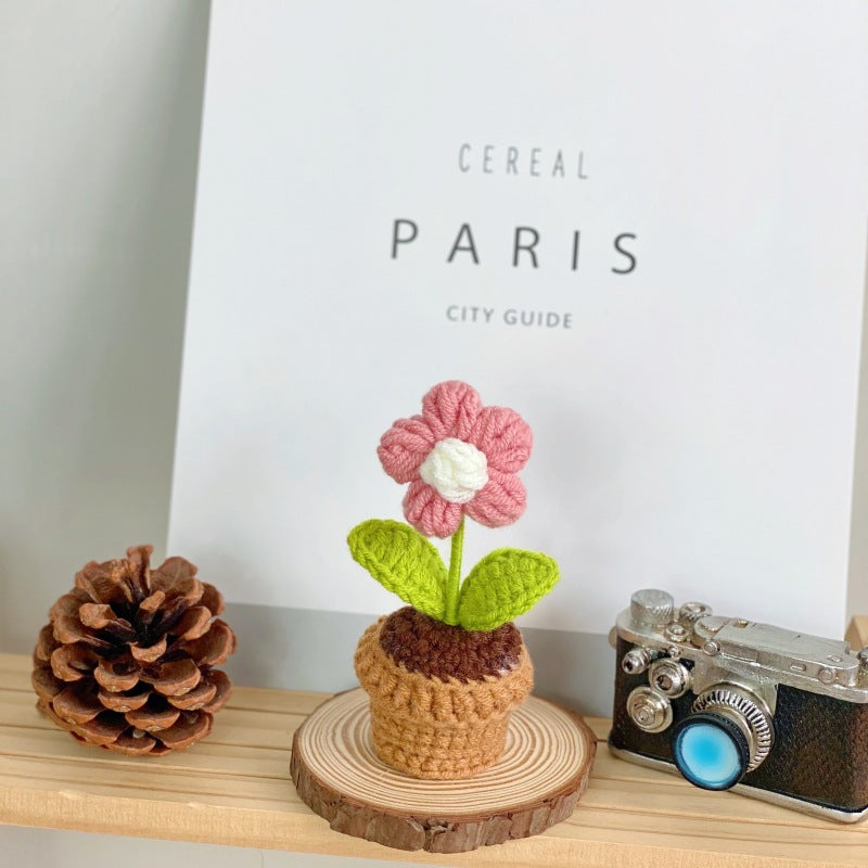 Artificial succulent arrangement on table