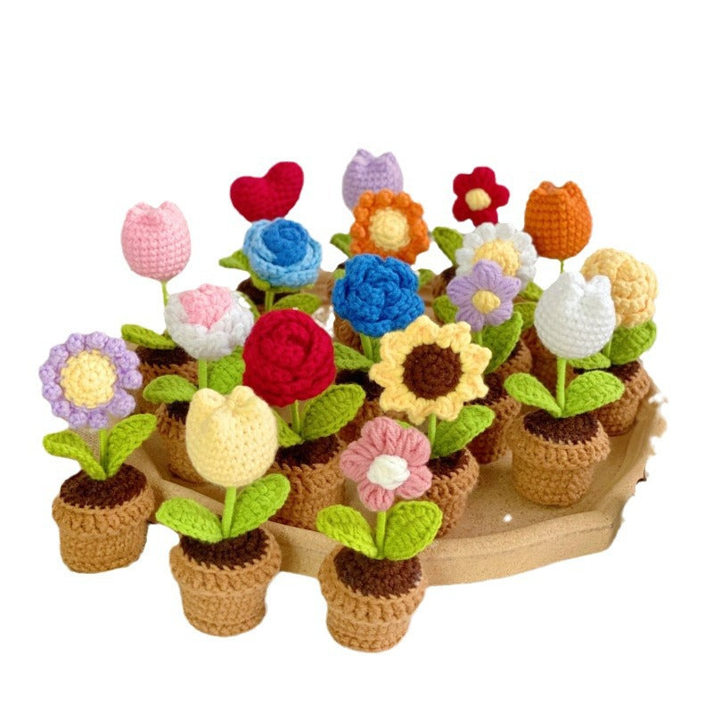 Artificial succulent arrangement on table