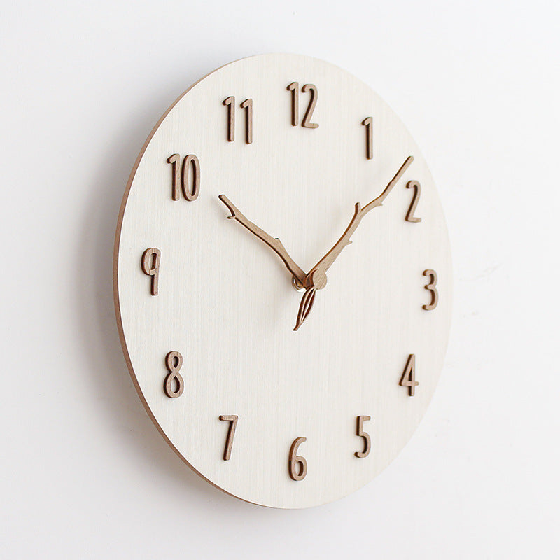 Elegant wooden wall clock against a neutral backdrop