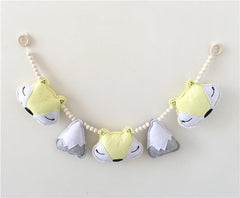 Nordic style fox and mountain bead decor hung in a nursery