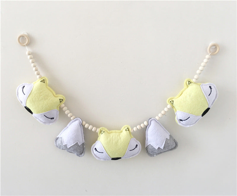 Nordic style fox and mountain bead decor hung in a nursery