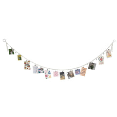 Vertical display of artwork on string with clips