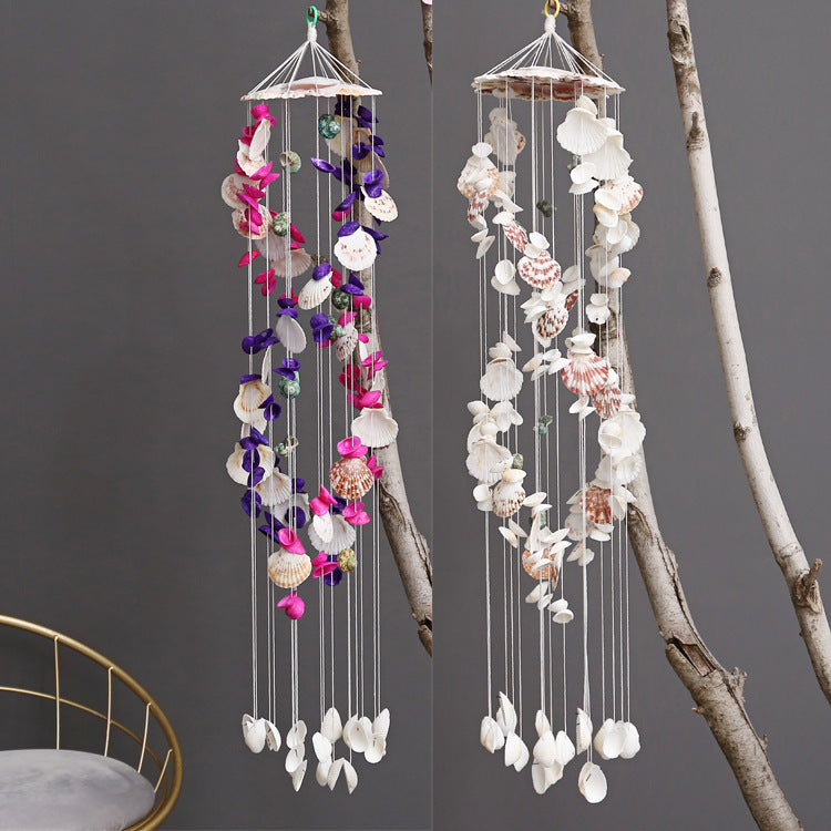 Close-up of colourful shell wind chime hanging outdoors