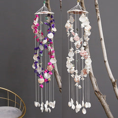 Close-up of colourful shell wind chime hanging outdoors
