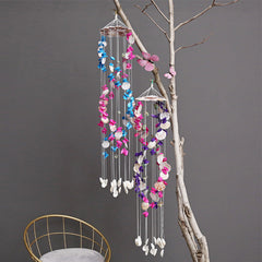 Elegant decorative wind chime in sunny garden