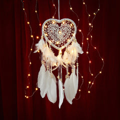 Close-up of fairy lights on dreamcatcher