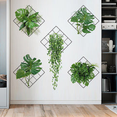 Multiple green plant hanging baskets on a wall