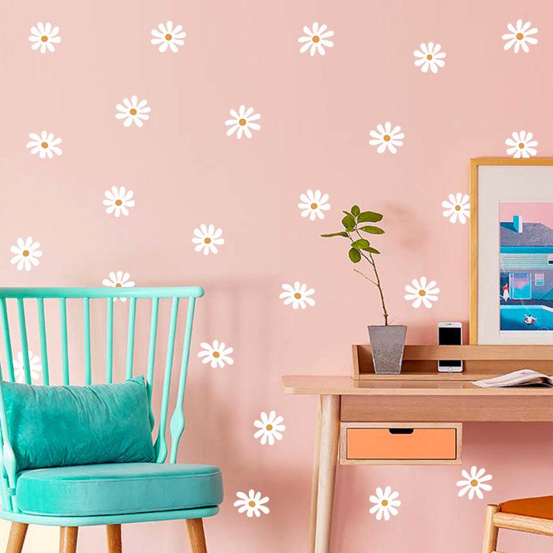 Self-adhesive daisy wall decals on a clean surface