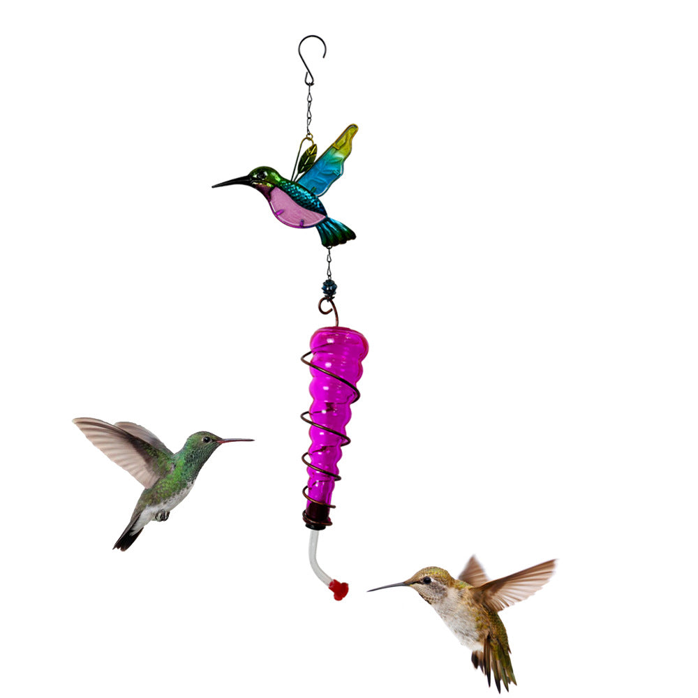 Multi-coloured wind chime in peaceful garden setting