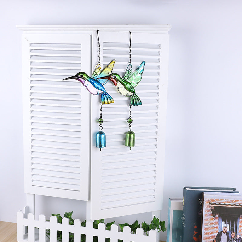 Vibrant metal and glass wind chime close-up view