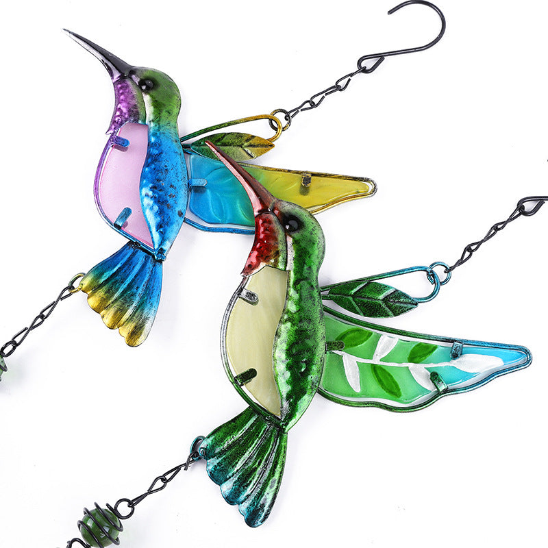 Handcrafted hummingbird wind chime outdoors