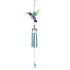 Multi-coloured wind chime in peaceful garden setting