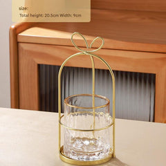 Gold stainless steel fruit fork stand at an angle