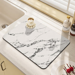 Kitchen sink with absorbent mat in position