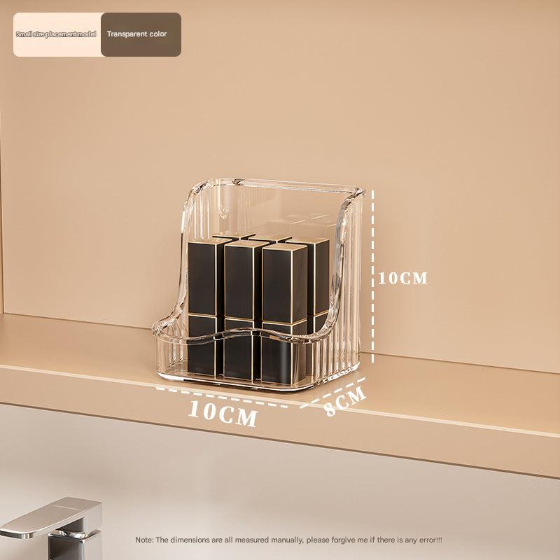 Organised wall-mounted makeup storage showing lipsticks