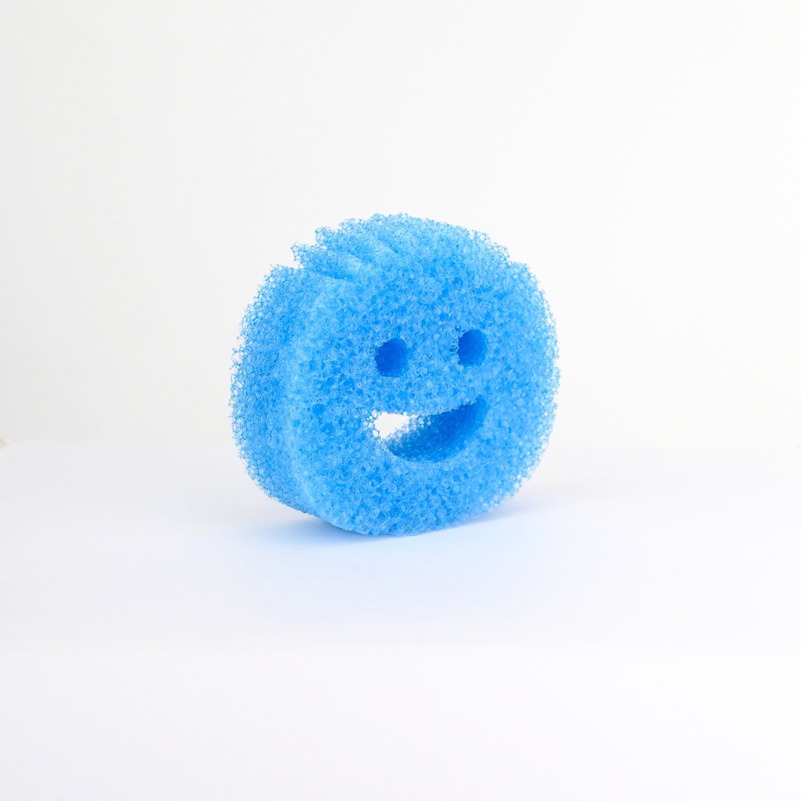 Biodegradable sponge next to dishes