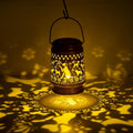 Hummingbird lanterns in floral arrangement