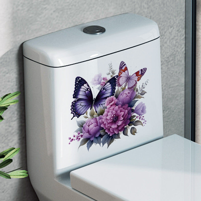 Close-up of butterfly toilet sticker on bathroom wall