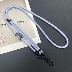 Mobile phone lanyard in a fashionable setting