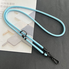 Close up of phone attached to adjustable lanyard