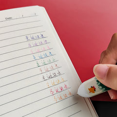 Group of colourful Christmas pens ready for writing