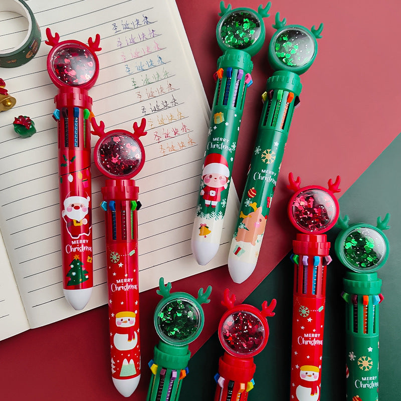 Close-up of Christmas-themed pens featuring Santa Claus