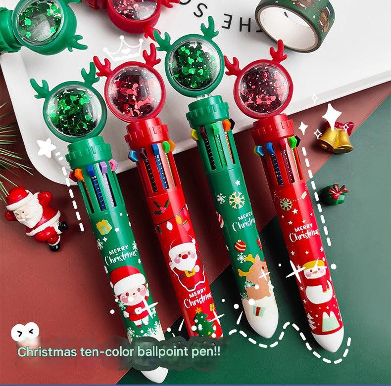 Close-up of Christmas-themed pens featuring Santa Claus